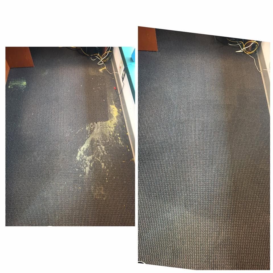 Side-by-side photos of a dark carpet with a large yellow stain on the left, cleaner on the right