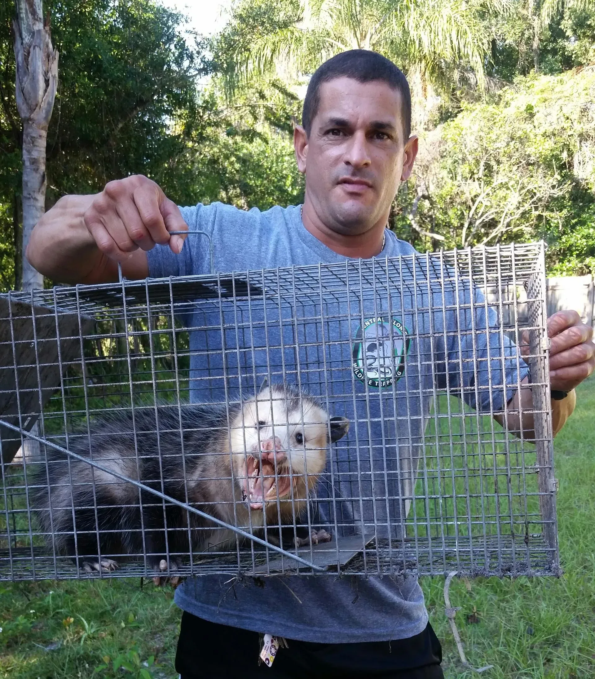 angel cortes holding a cage