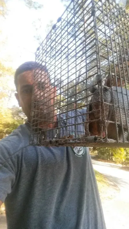 angel cortes holding a cage