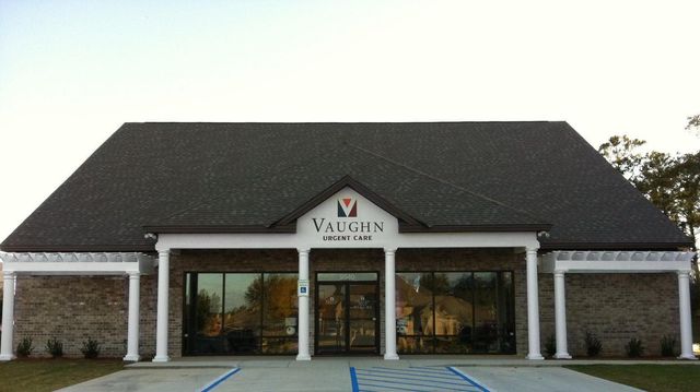 A vaughn building with a handicapped parking spot in front of it