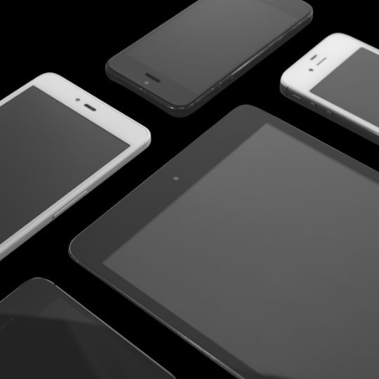 A group of cell phones and a tablet on a black background