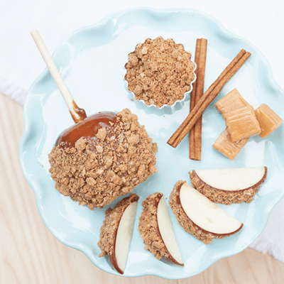 Granola and coconut topped ice cream pops on a pale blue plate