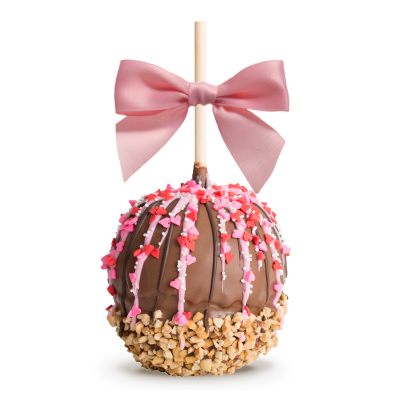 Chocolate caramel apple with pink sprinkles and a pink ribbon bow on a stick