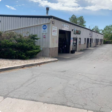 A white building with a sign that says 45 on it | Patterson Custom Diesel/Automotive