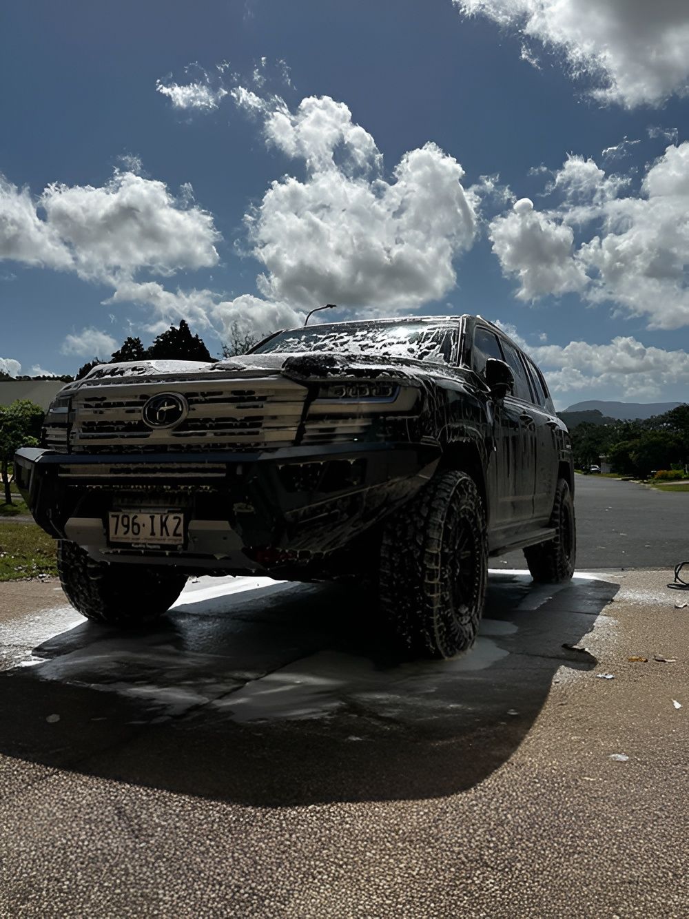 Black Suv Covered in Soap Suds, Being Washed — Mobile Club Cars Cairns in Earlville, QLD