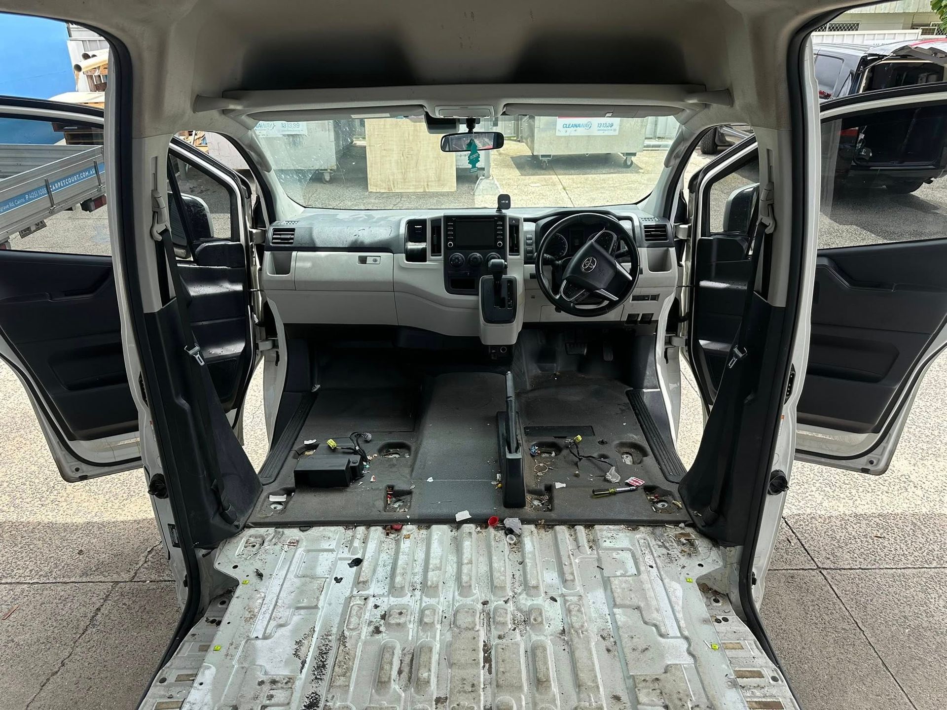Open Back of a White Cargo Van Interior With White Walls — Mobile Club Cars Cairns in Earlville, QLD