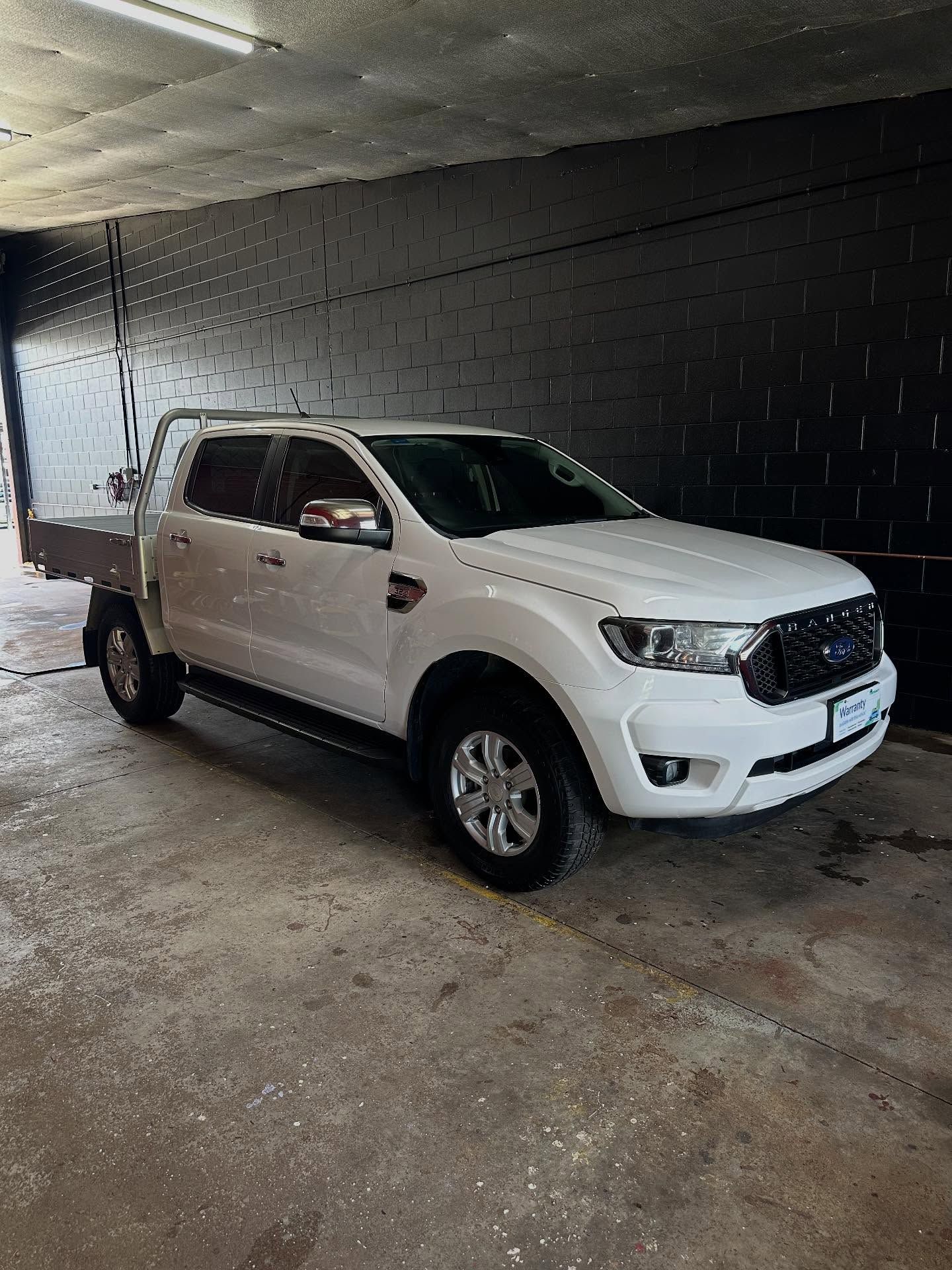 A White Ford Ranger Vehicle Parked a Concrete Floor — Mobile Club Cars Cairns in Earlville, QLD