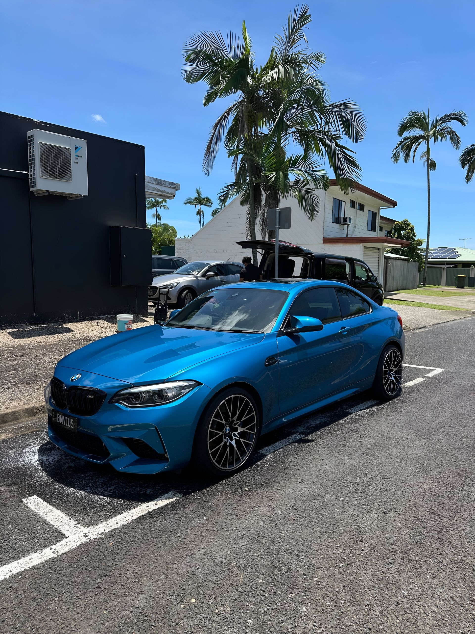 Blue Bmw Coupe Parked in a Lot — Mobile Club Cars Cairns in Earlville, QLD