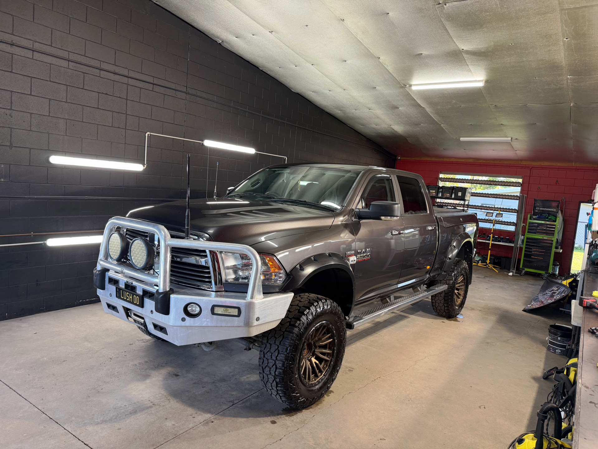 Grey Lifted Pickup Truck in A Garage — Mobile Club Cars Cairns in Earlville, QLD