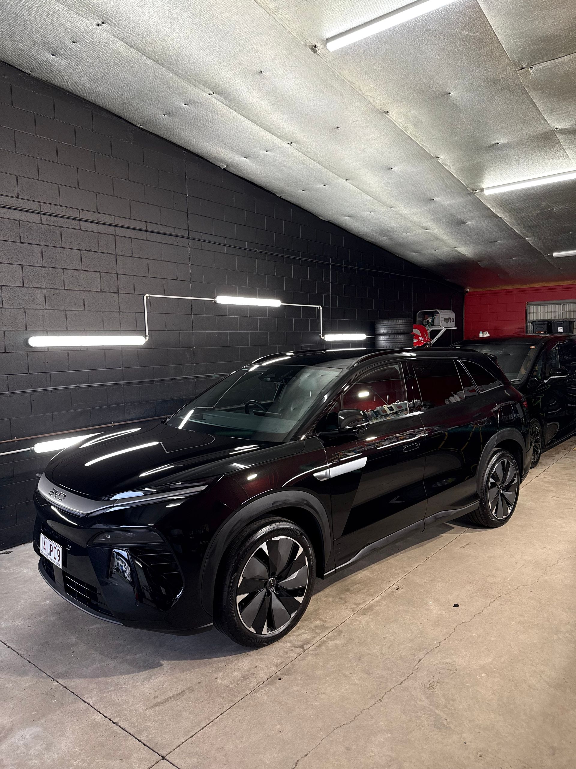 Black SUV parked in An Indoor Garage — Mobile Club Cars Cairns in Earlville, QLD