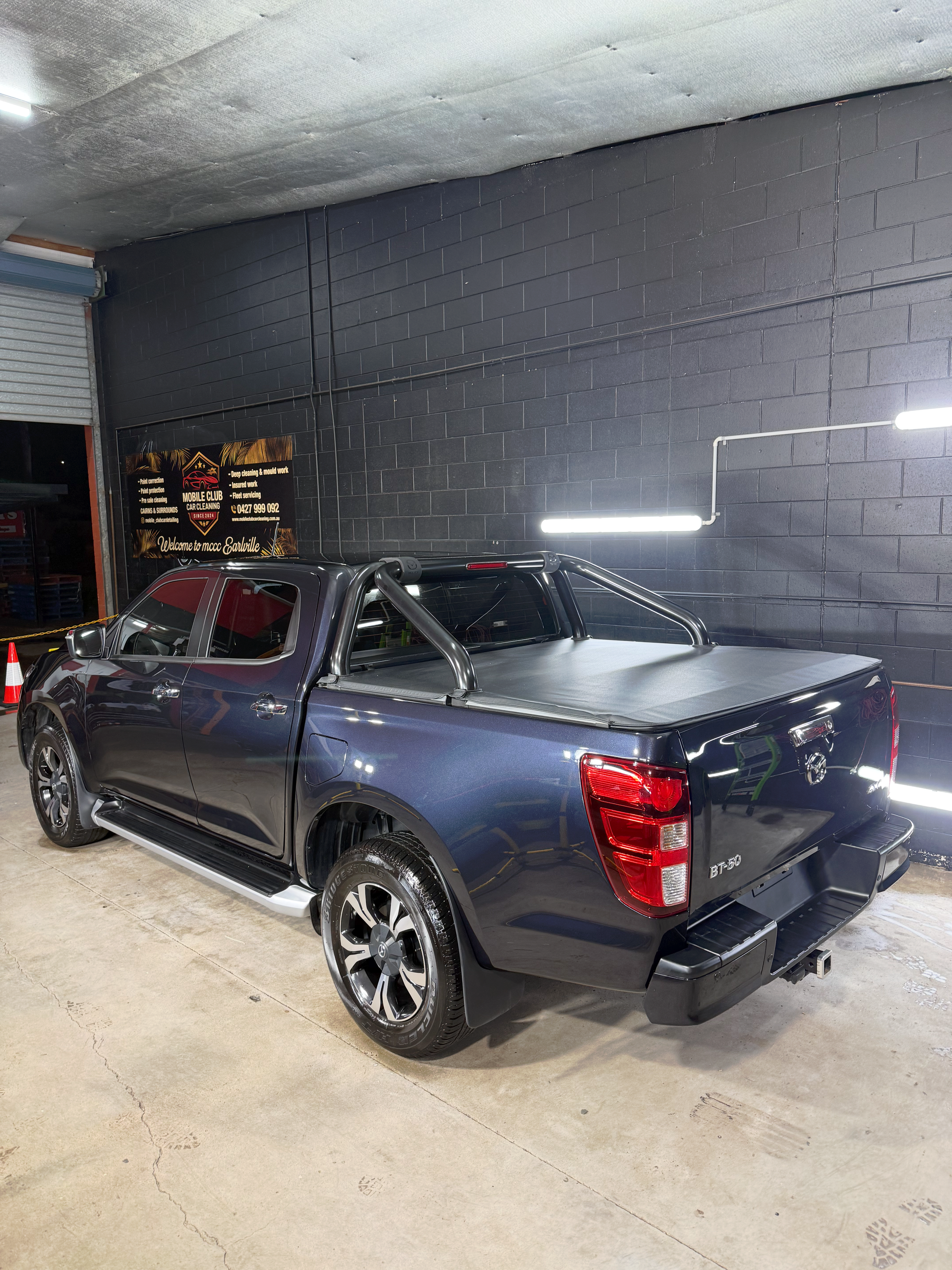 Dark Blue Pickup Truck Parked Inside a Garage — Mobile Club Cars Cairns in Earlville, QLD