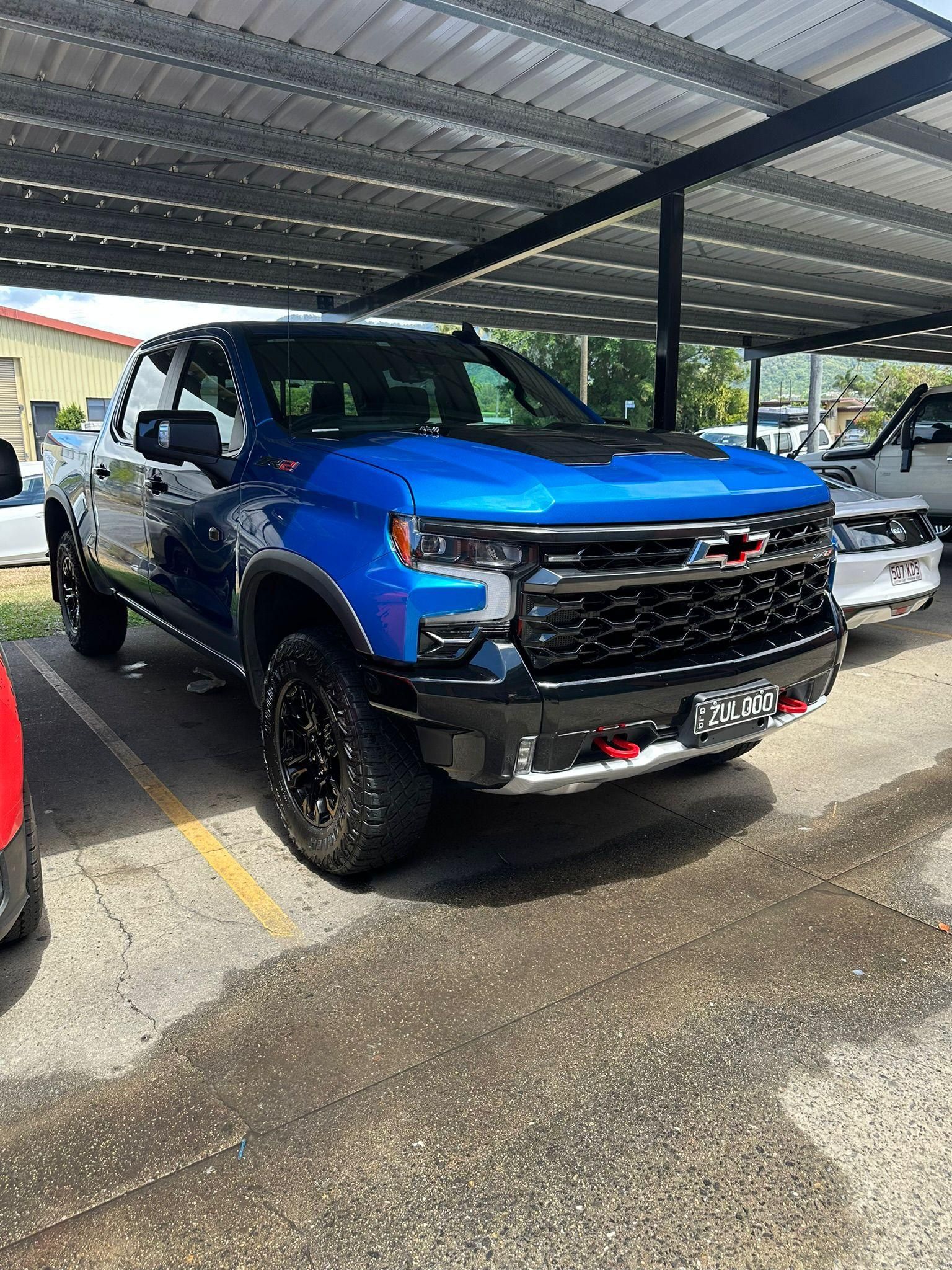 Blue Chevrolet Silverado Truck Parked Under a Covered Area — Mobile Club Cars Cairns in Earlville, QLD