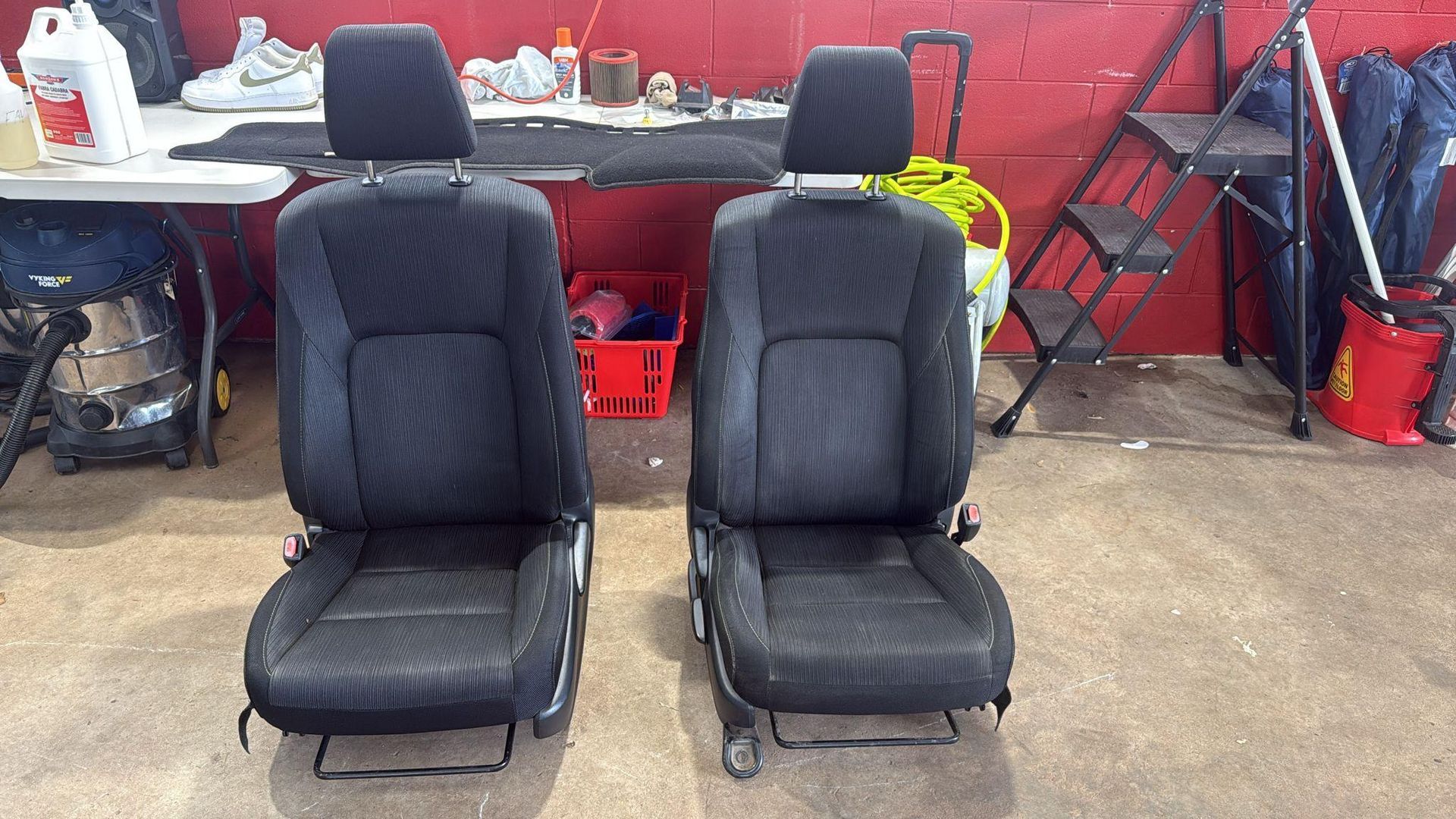 Two Black Fabric Vehicle Seats Stand — Mobile Club Cars Cairns in Earlville, QLD