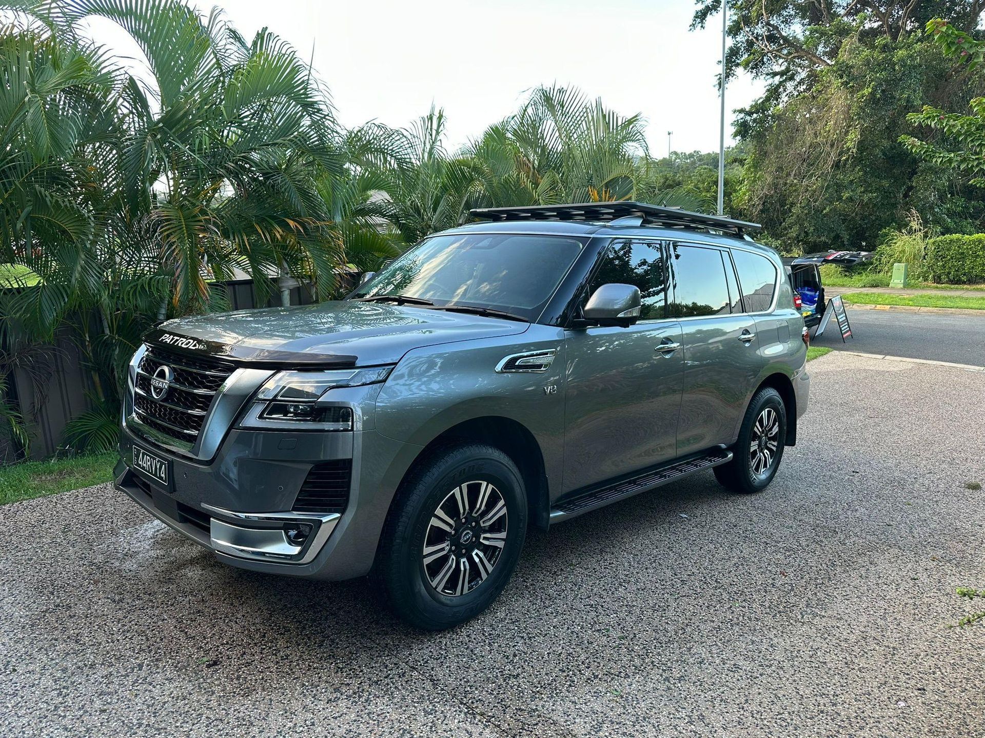 Grey Nissan Patrol SUV Parked on Gravel Driveway, Surrounded by Greenery — Mobile Club Cars Cairns in Earlville, QLD