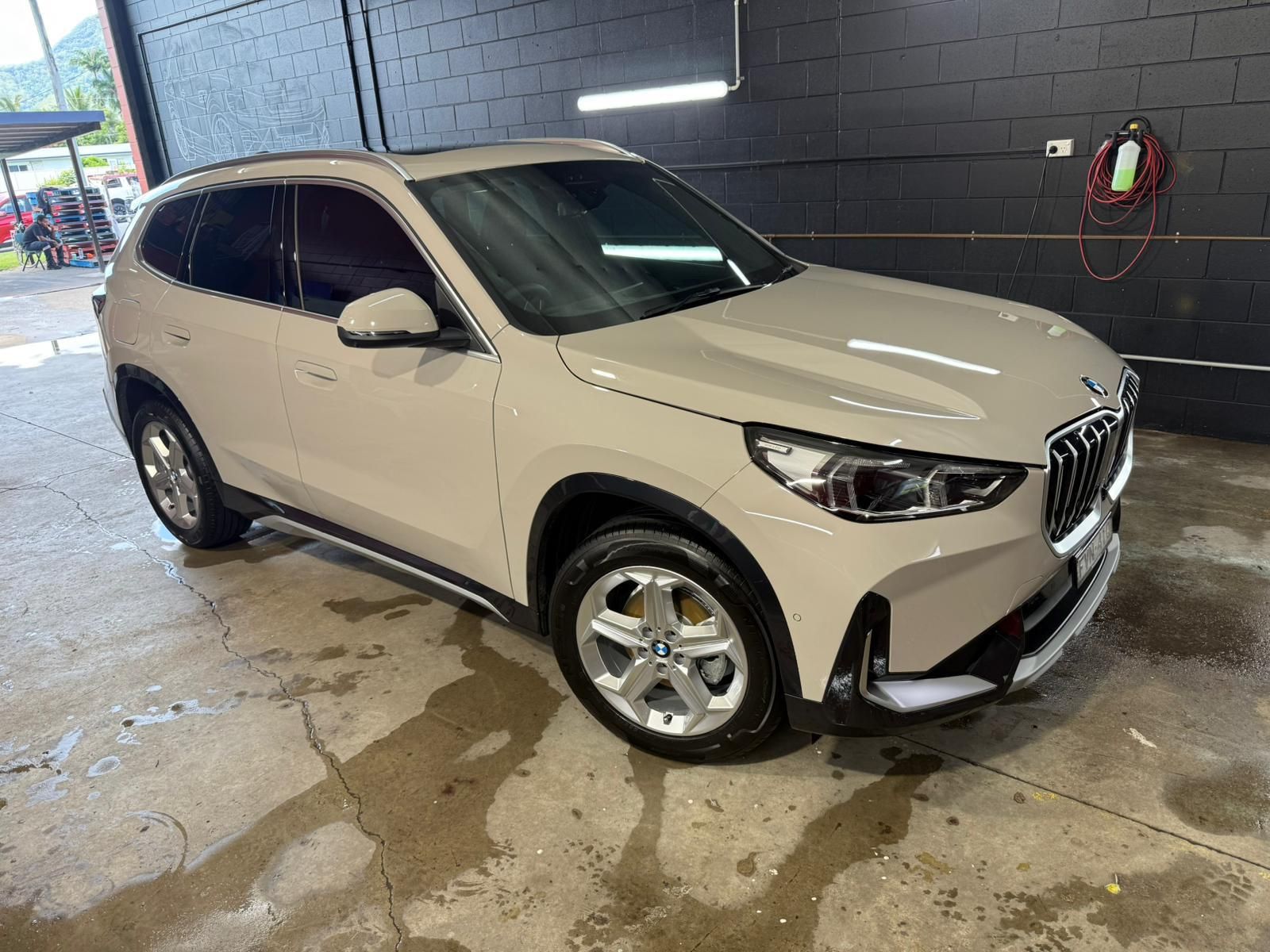 Beige BMW SUV Parked in A Garage — Mobile Club Cars Cairns in Earlville, QLD