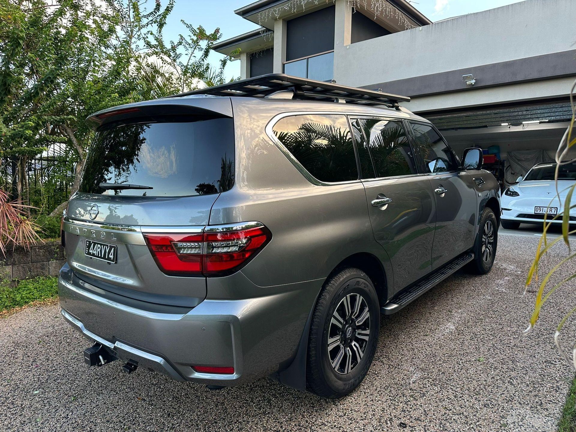 Grey SUV Parked on A Gravel Driveway in Front of A House — Mobile Club Cars Cairns in Earlville, QLD
