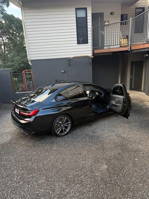 Black Car Parked Outside a Building with Its Door Open — Mobile Club Cars Cairns in Earlville, QLD