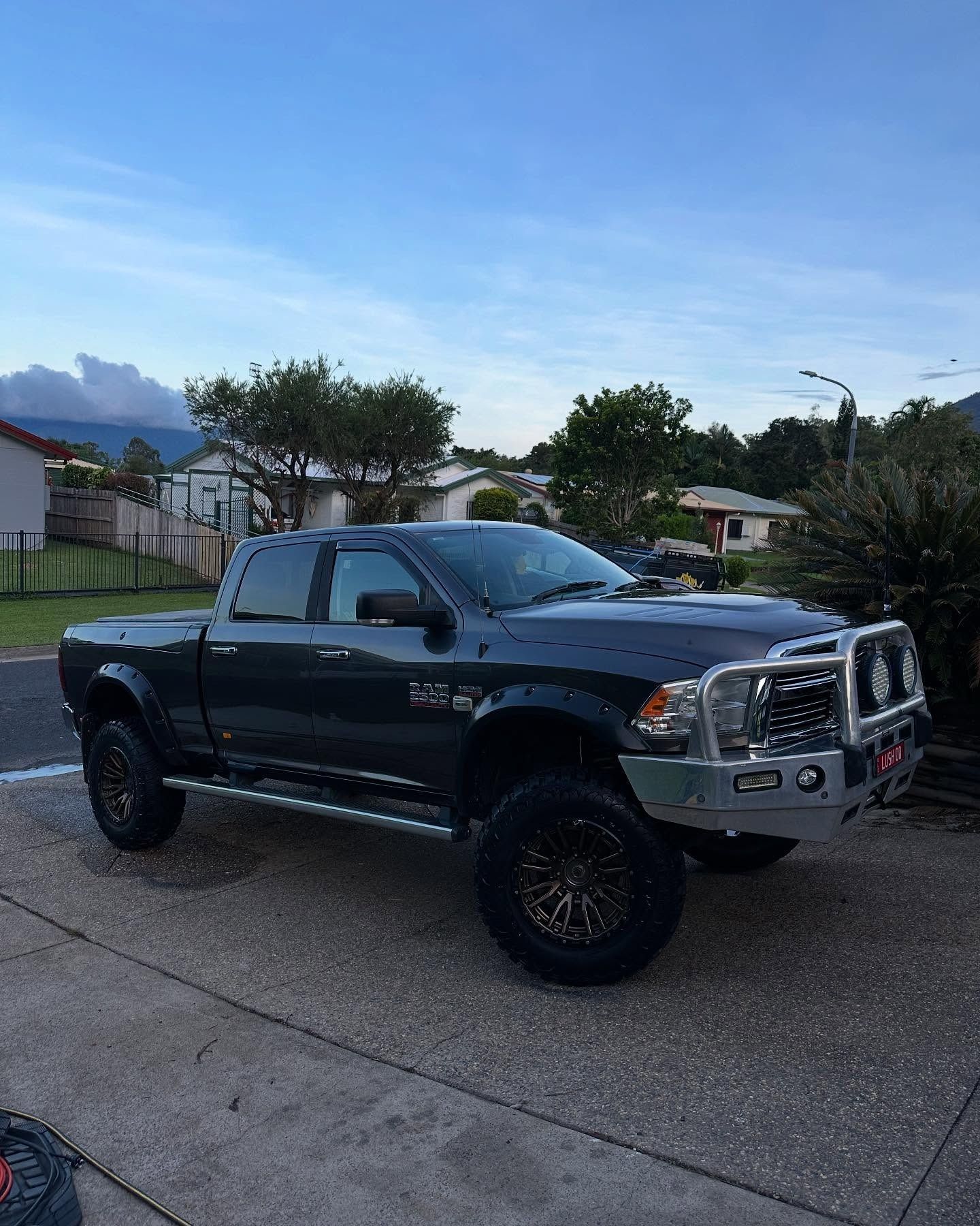 Dark Grey Lifted Pickup Truck Parked on Pavement —Mobile Club Cars Cairns in Earlville, QLD