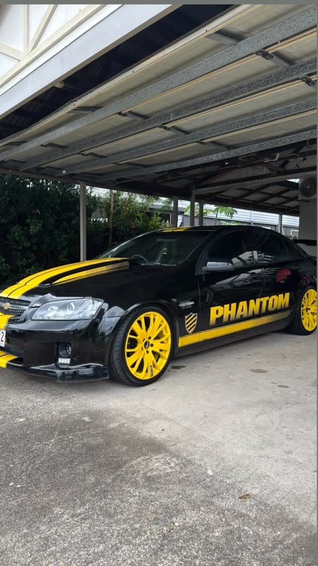 Black and Yellow Custom Car Parked Under a Carport — Mobile Club Cars Cairns in Earlville, QLD