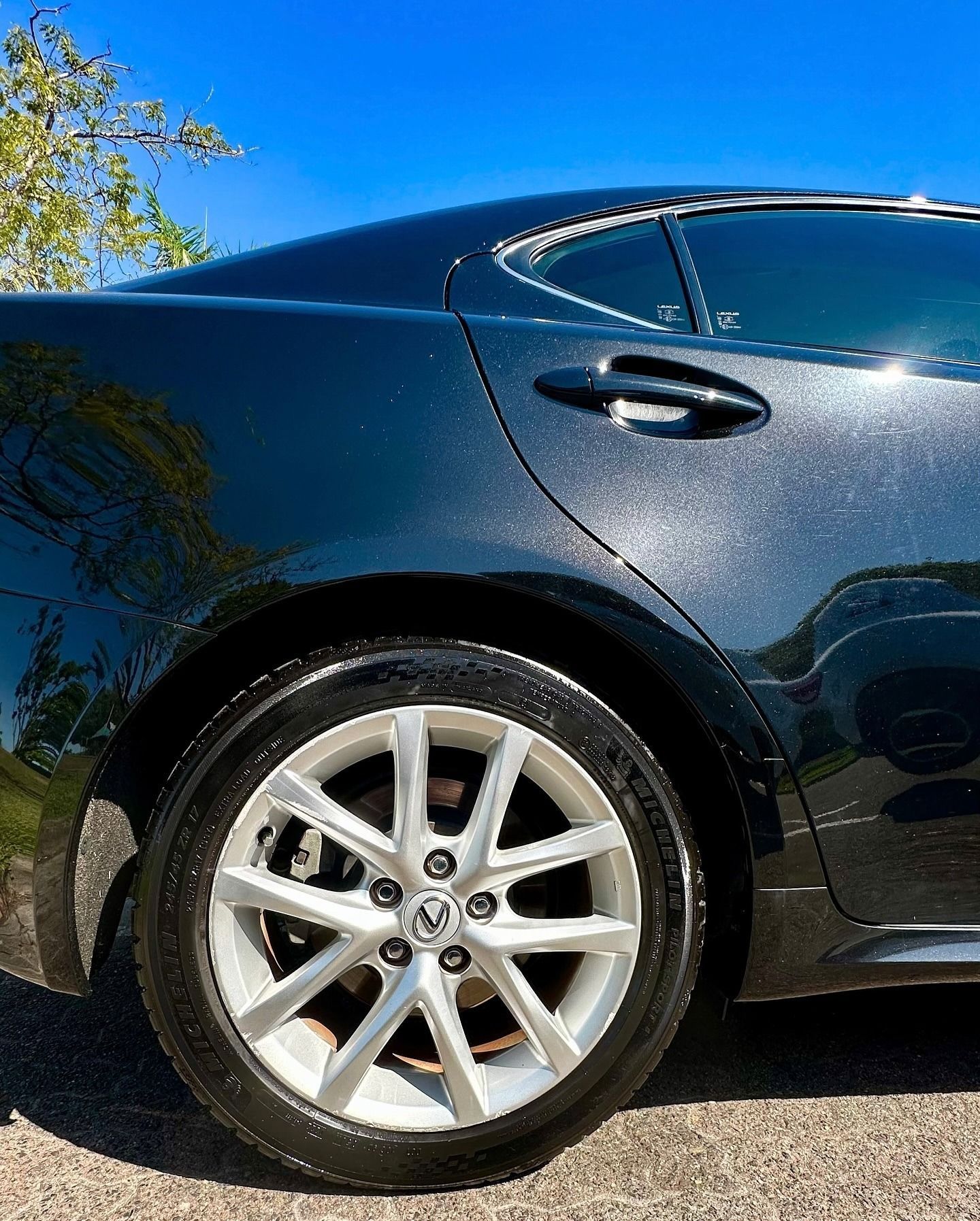 A Close-up View of the Rear Side of a Metallic Dark-colored Car — Mobile Club Cars Cairns in Babinda, QLD