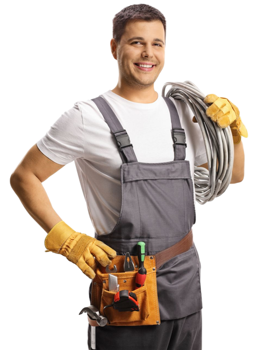 Electrician in gray overalls smiling, holding coiled cable and wearing yellow gloves with tool belt