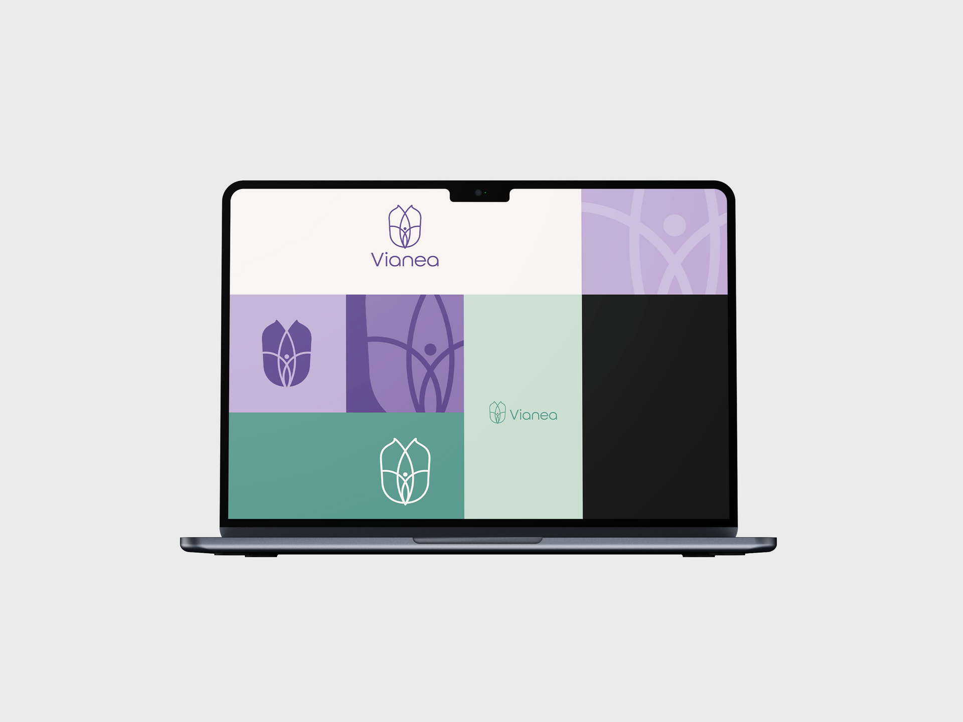 Laptop mit einem pastellgrünen und violetten Kachelbildschirm, der Logos und abstrakte Formen anzeigt