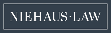 White “NIEHAUS·LAW” text inside a thin white rectangular border on a dark blue background.
