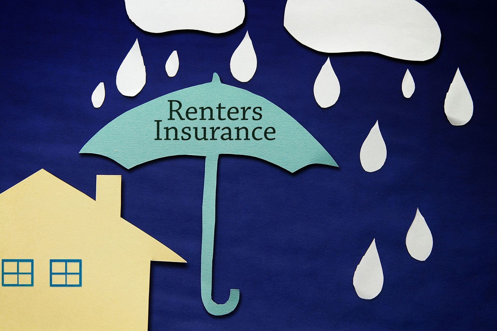 Illustration: Yellow house and blue umbrella labeled