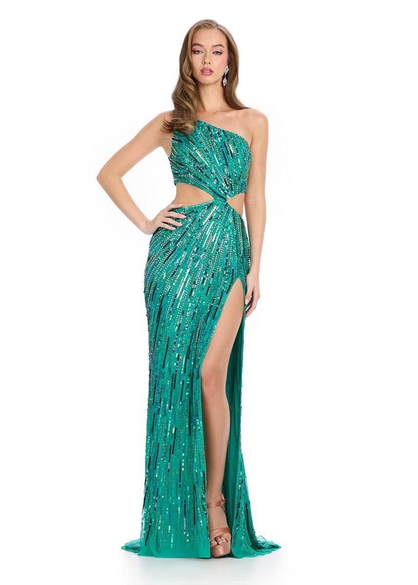 Woman in a teal sequined gown with a thigh-high slit, posing against a white background.