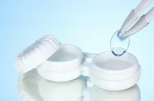 Two clear glass bowls on a blue water surface with ripples