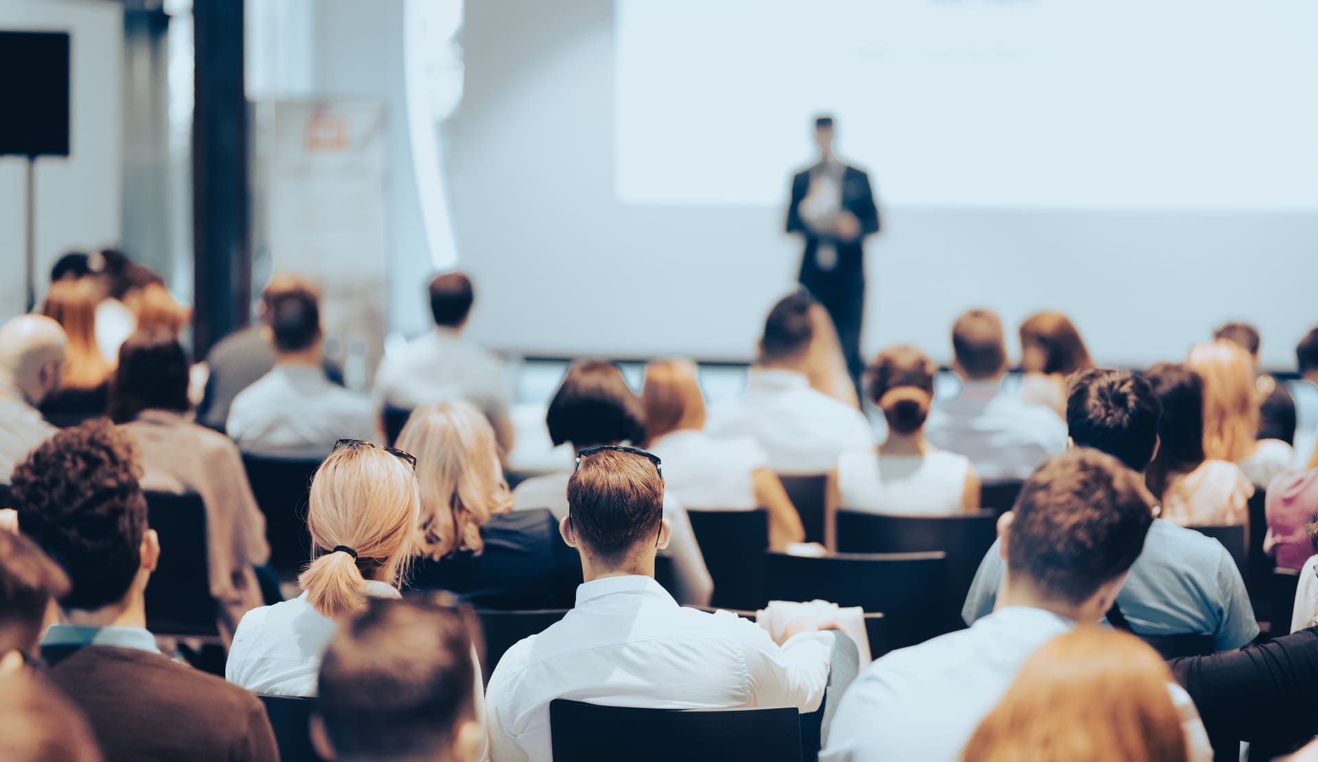 Business speaker giving a talk at business conference event