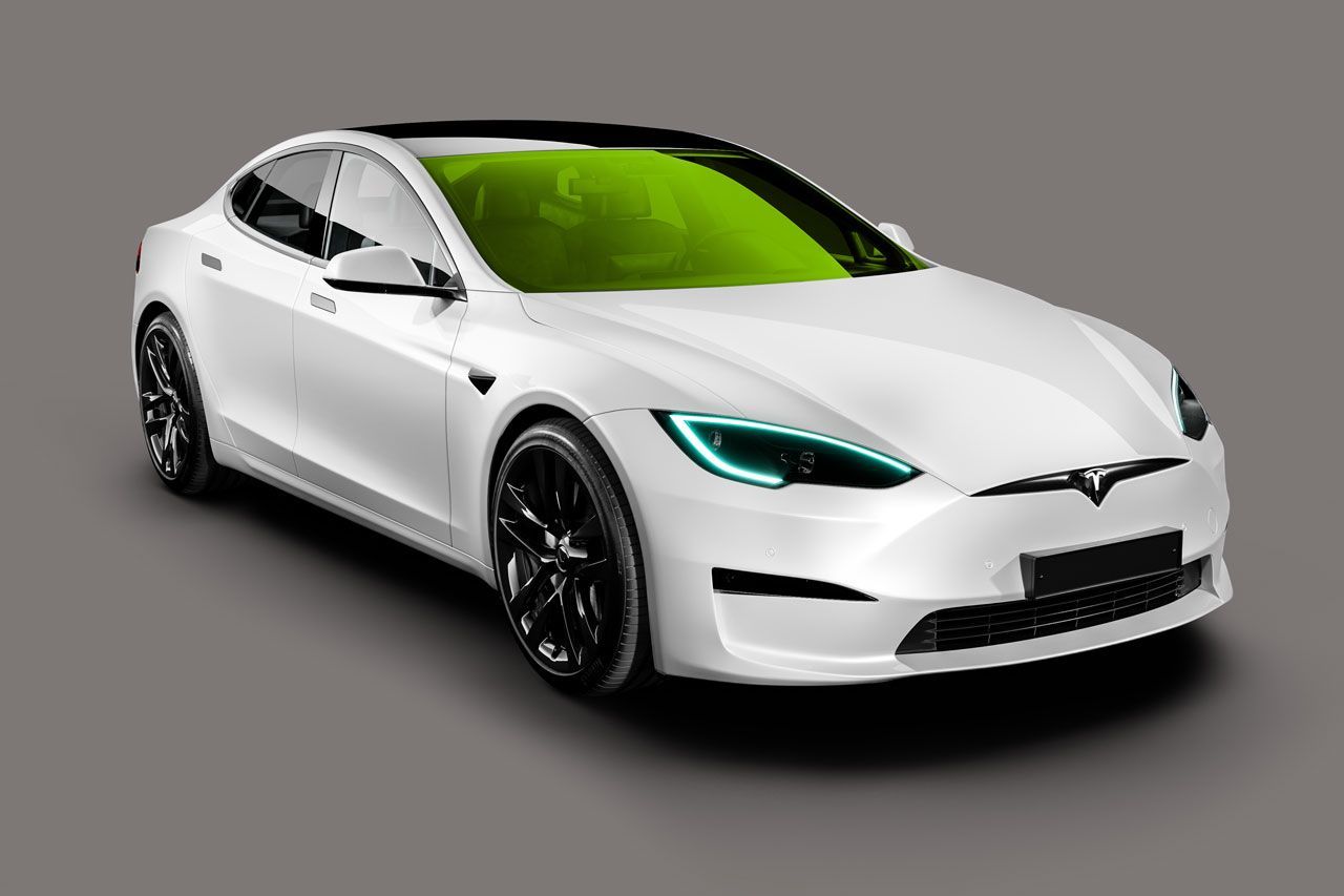 A white tesla model s with a green windshield on a gray background.