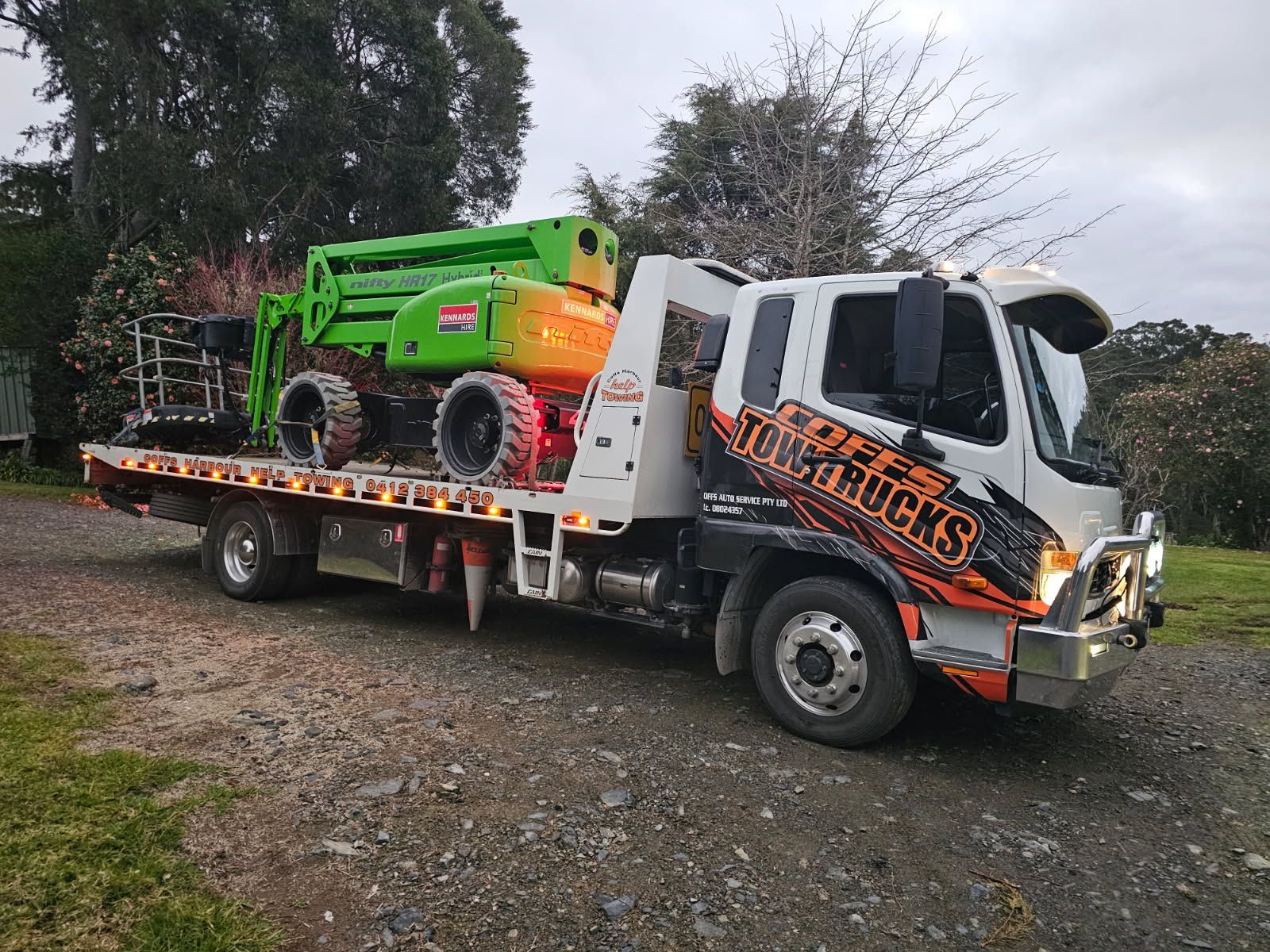 Tow Truck Hauling A Bright Green Off-road Vehicle — Coffs Tow Trucks In North Boambee Valley, NSW