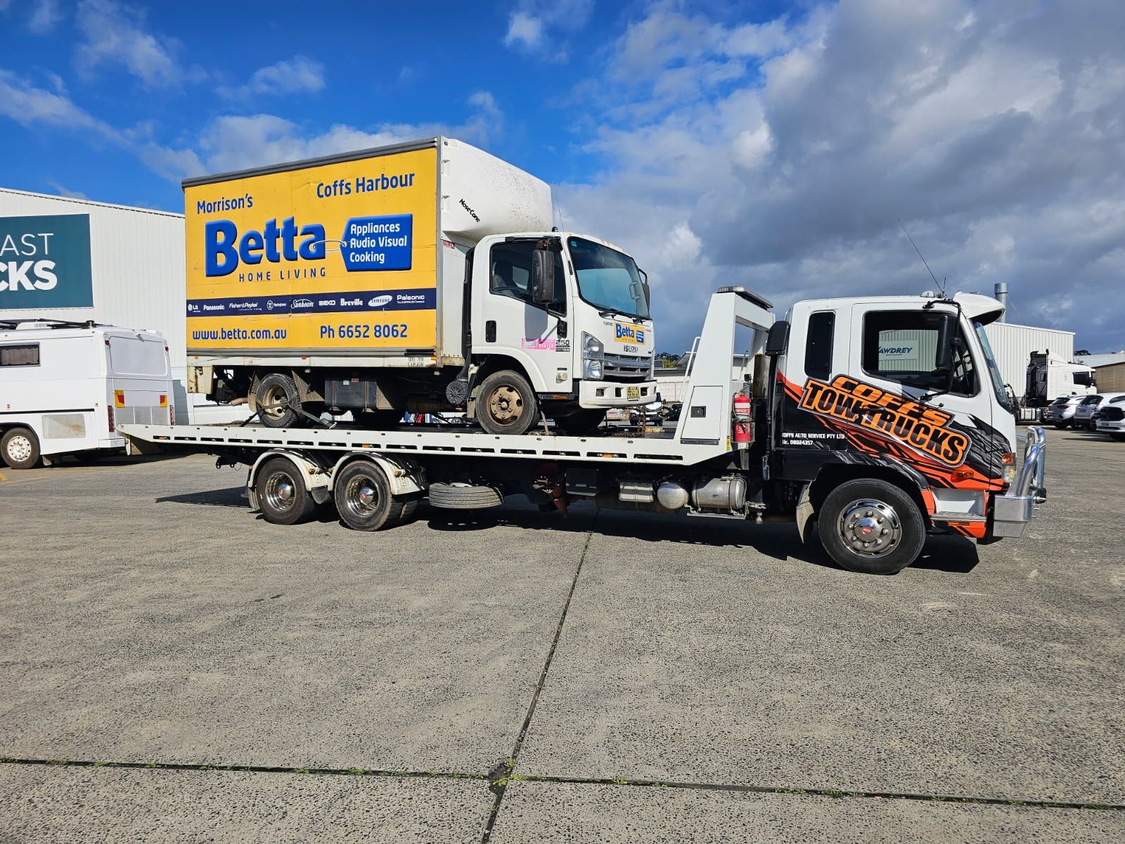 Tow Truck Hauling A White Box Truck With A Yellow Betta  — Coffs Tow Trucks In North Boambee Valley, NSW