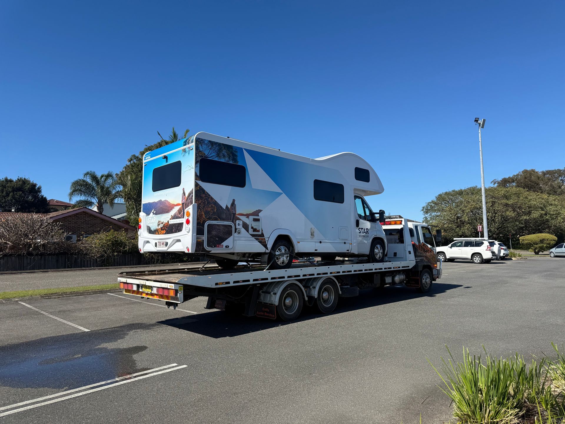 Tow Truck Hauling A White Rv — Coffs Tow Trucks In Sawtell, NSW