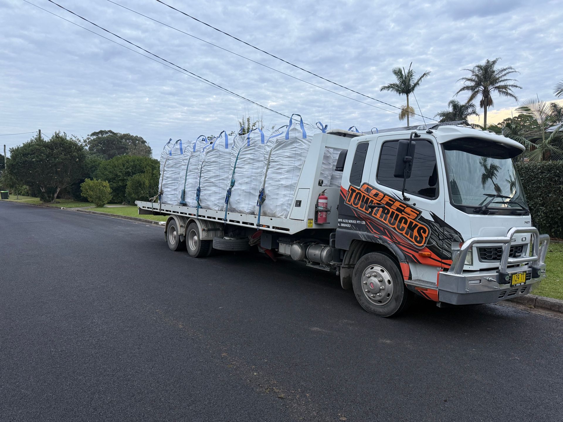 White Cargo Truck Loaded With Stacked Bags — Coffs Tow Trucks In North Boambee Valley, NSW