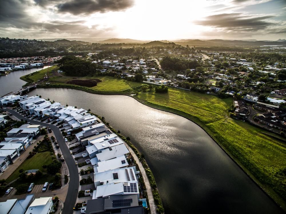 An Aerial View Of A City With A Lake In The Middle Of It — X-Terminate Pest Control In Buderim, QLD