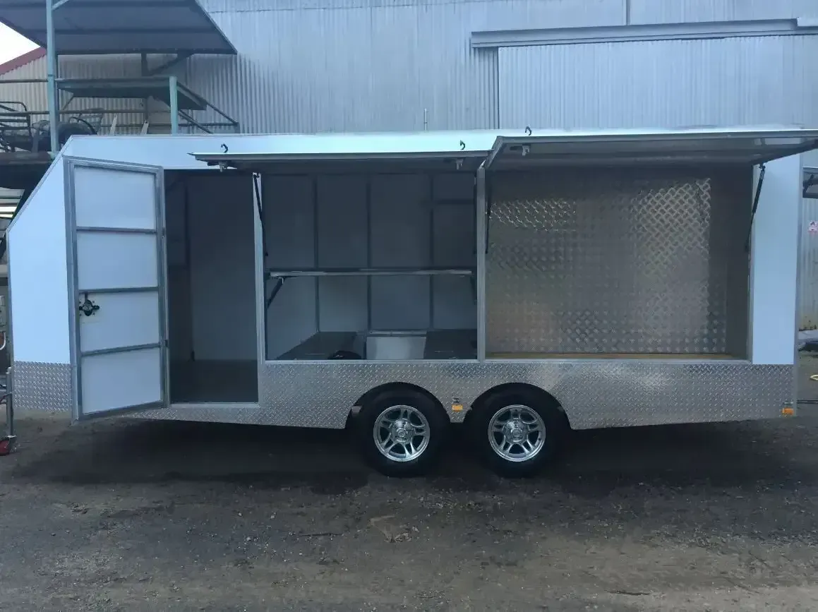 A Trailer With The Doors Open Is Parked In Front Of A Building — Agriweld Engineering in Dubbo, NSW