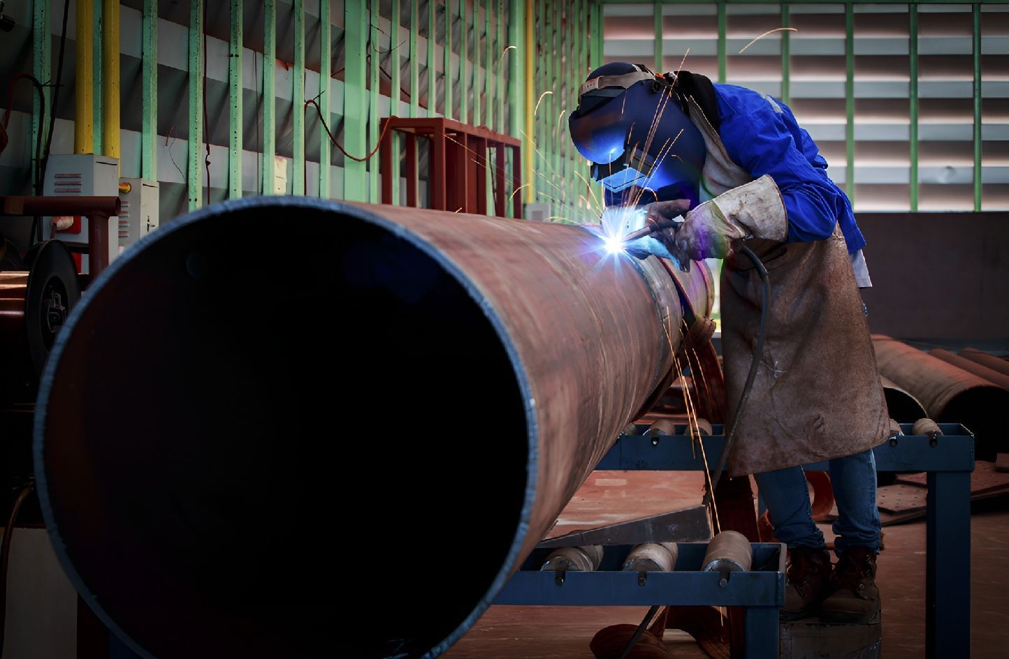 Welder Joining Thick Metal Pipe