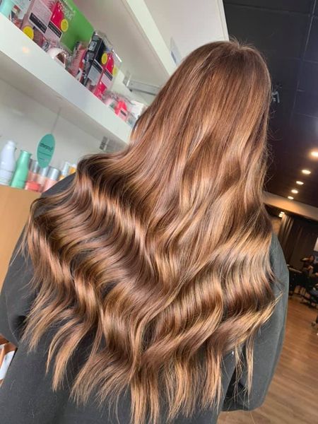 Woman With Long, Wavy Auburn Hair. Indoors, Salon Setting — Gina T Hair & Beauty In Mackay, QLD