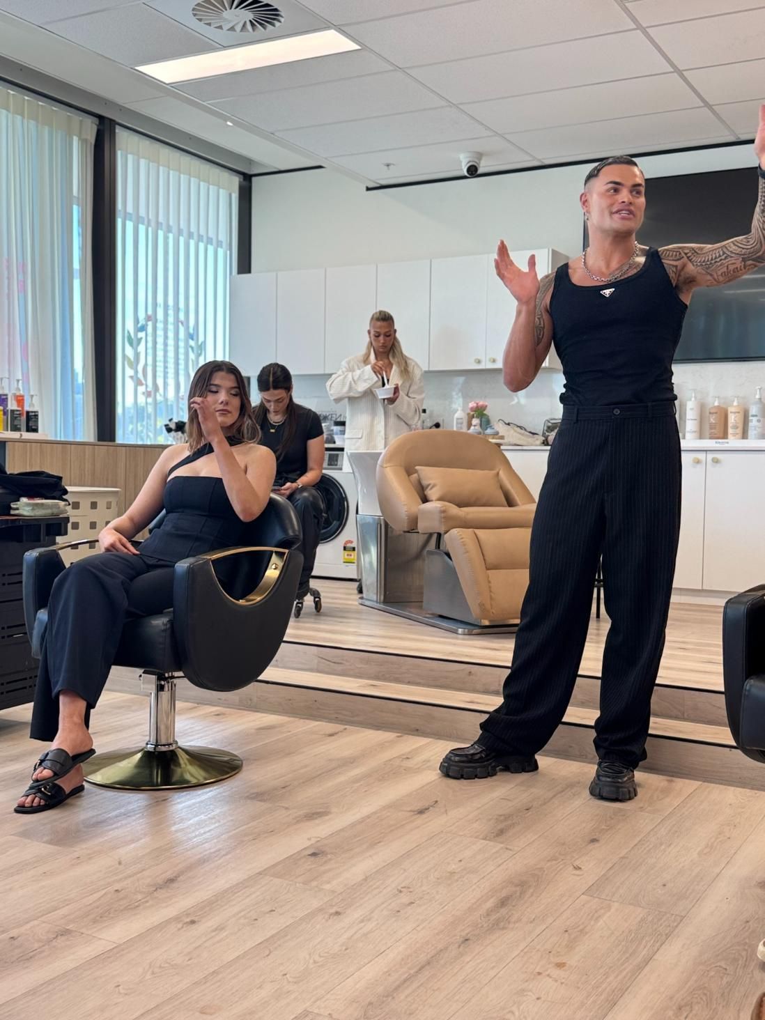 A Man With Tattoos Gestures — Gina T Hair & Beauty In Mackay, QLD