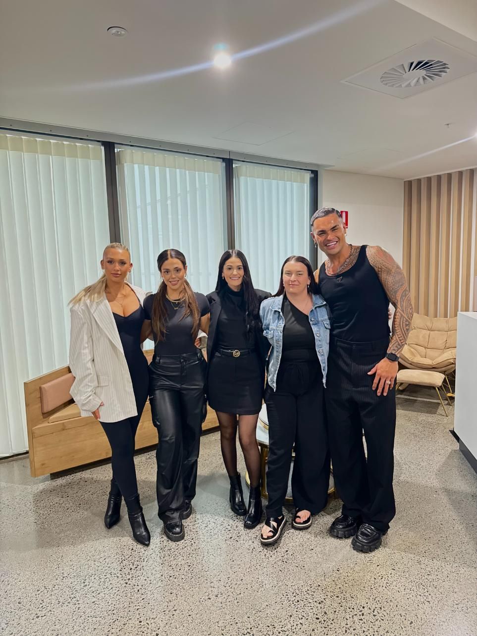 Five People Posing Indoors, All in Black Outfits — Gina T Hair & Beauty In Mackay, QLD