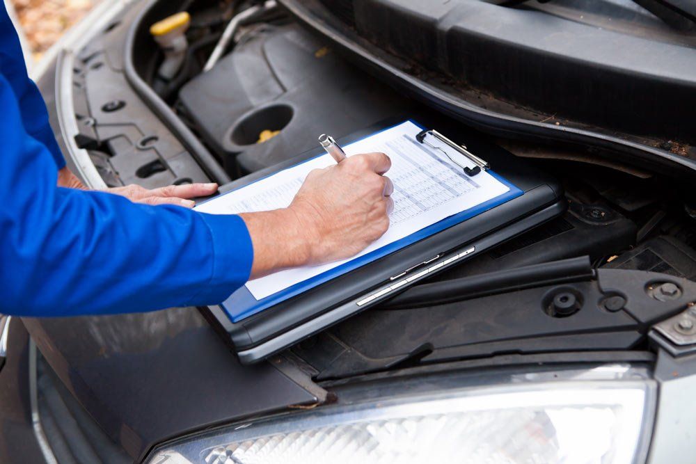 Mechanic Checking Car — Evco Automotive in South Albury, NSW