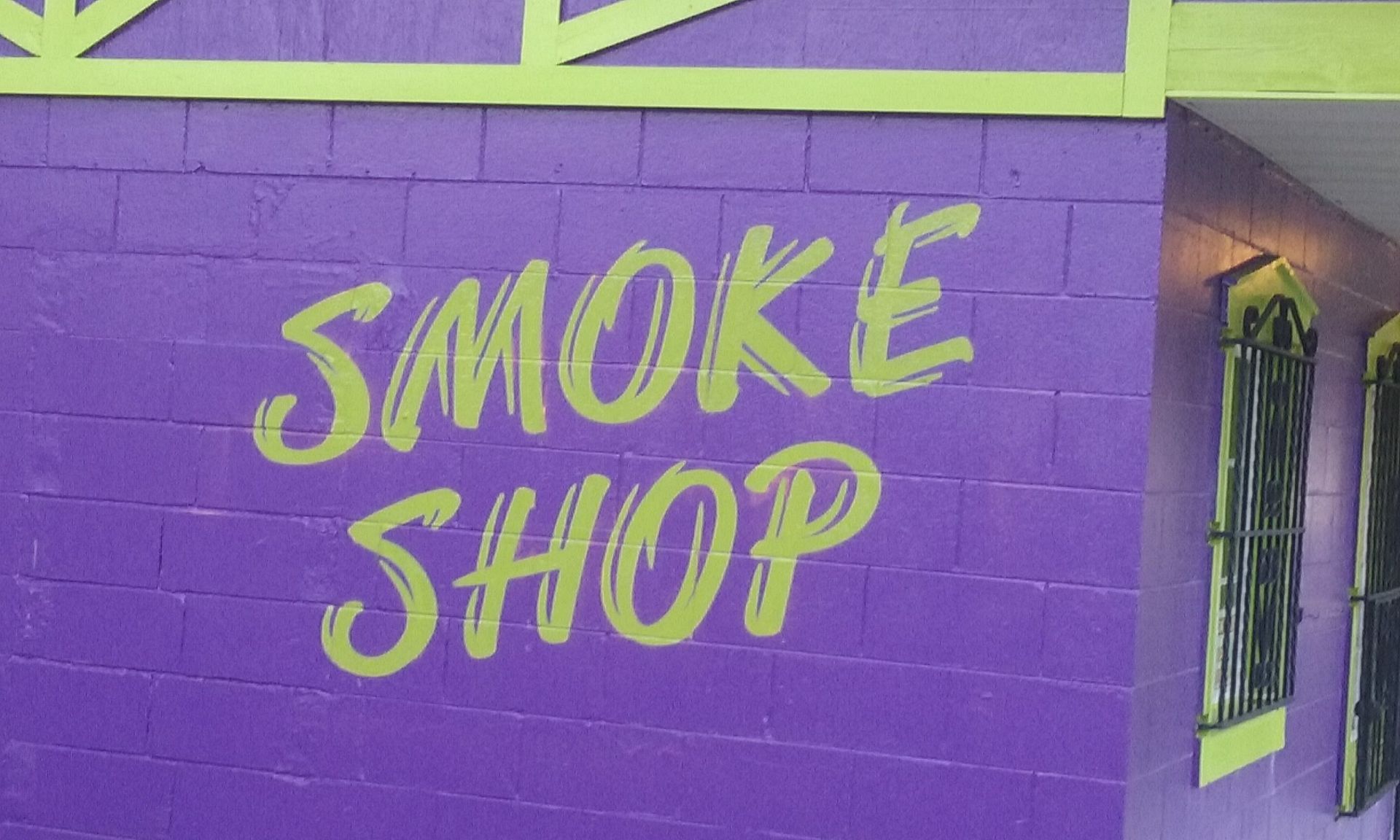 Purple brick wall with a lime green 