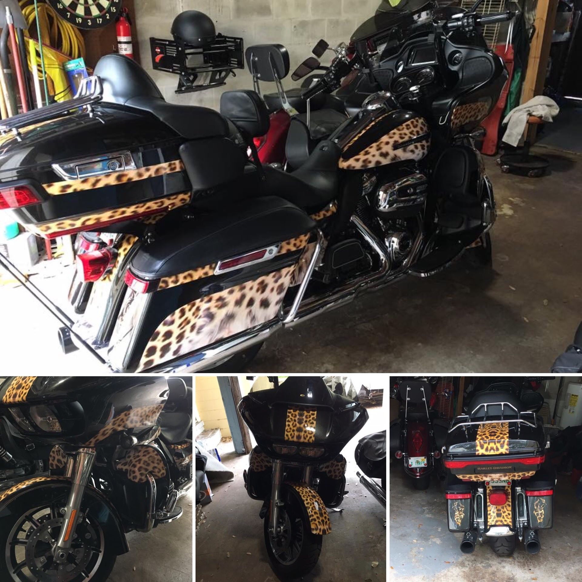 Black motorcycle with leopard print accents in a garage.