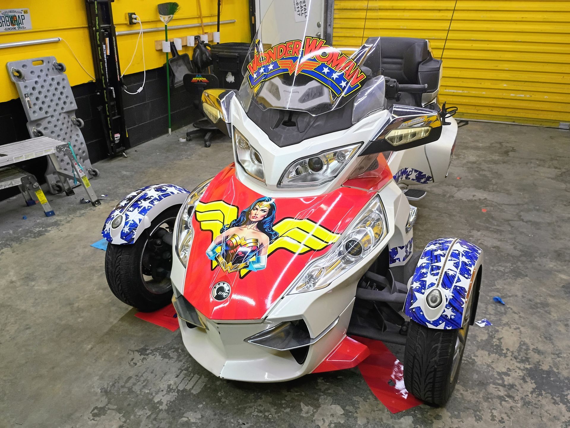 White, red, and blue Wonder Woman-themed Can-Am Spyder motorcycle.