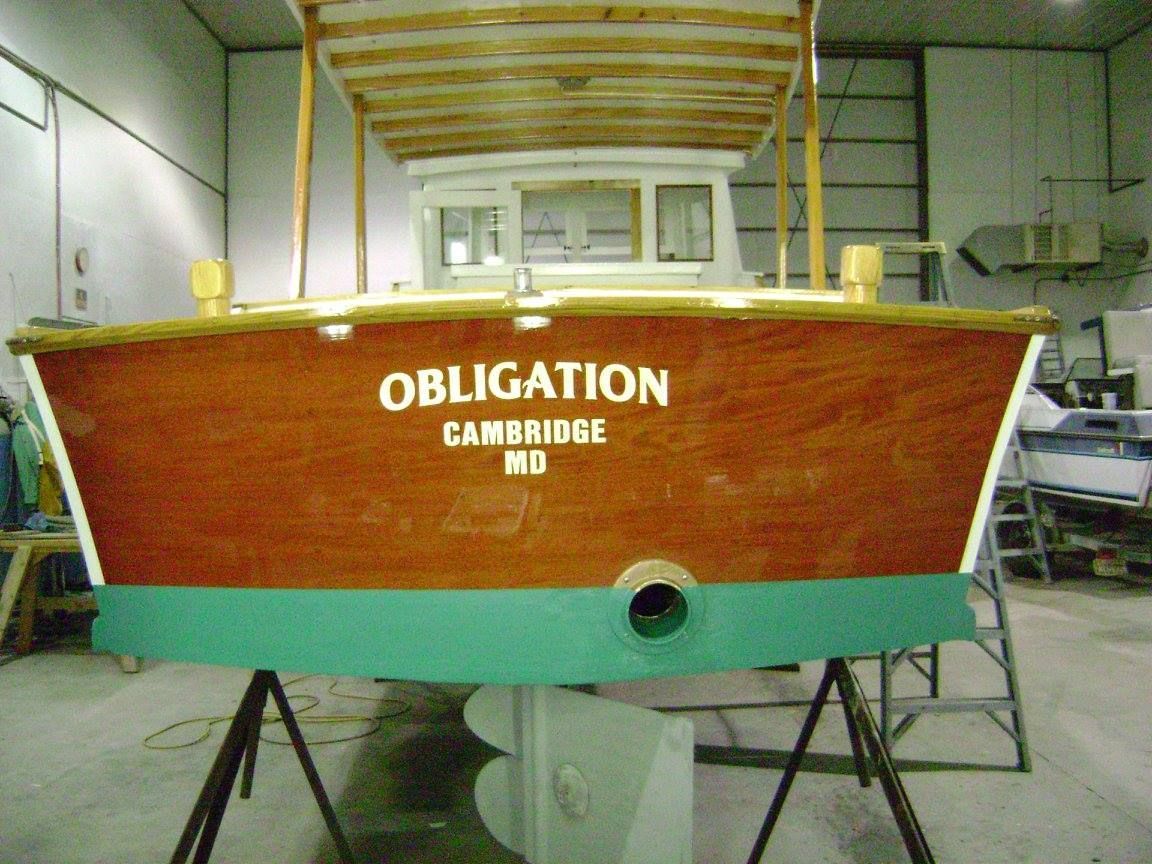 A boat with the name obligation on it