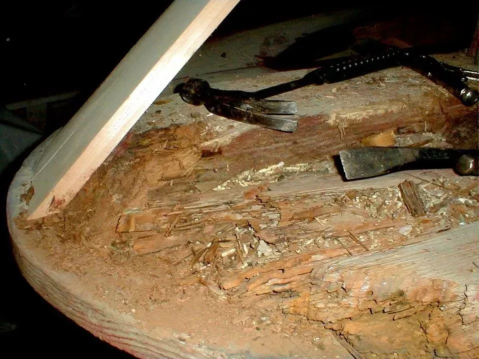 A close up of a piece of wood with tools on it