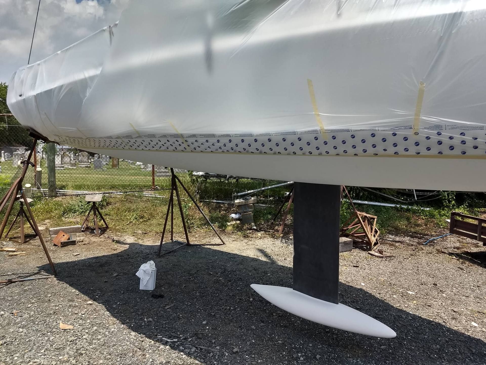 The bottom of a boat is covered in plastic.