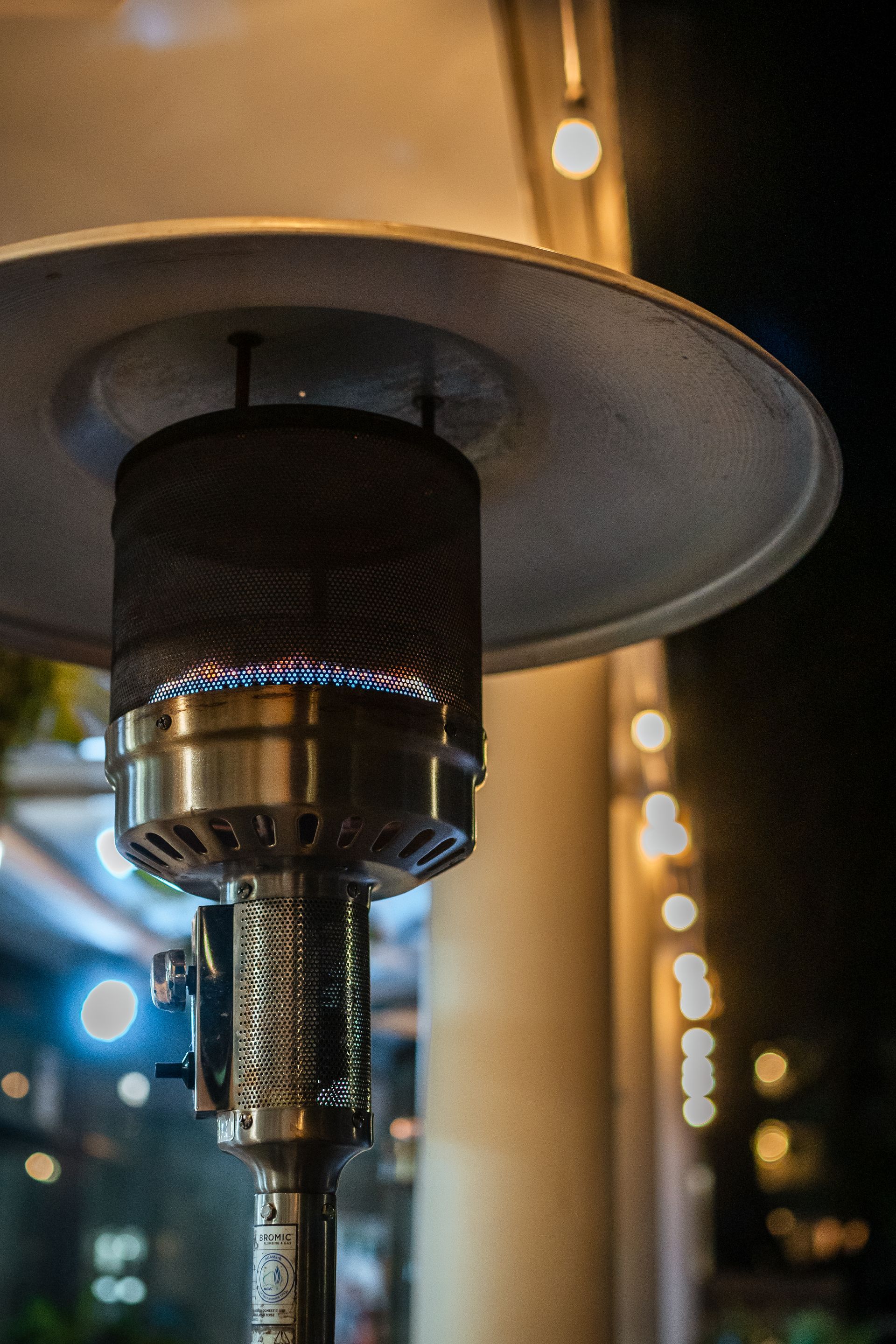 A Patio Heater Is Lit up At Night in Front of A Building — Chop 'n Chill in Port Macquarie, NSW